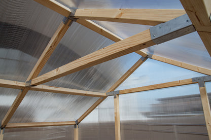 Casa Wooden Greenhouse — interior timber frame structure