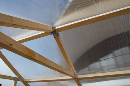 Casa Wooden Greenhouse — roof frame detail with timber trusses and polycarbonate panels
